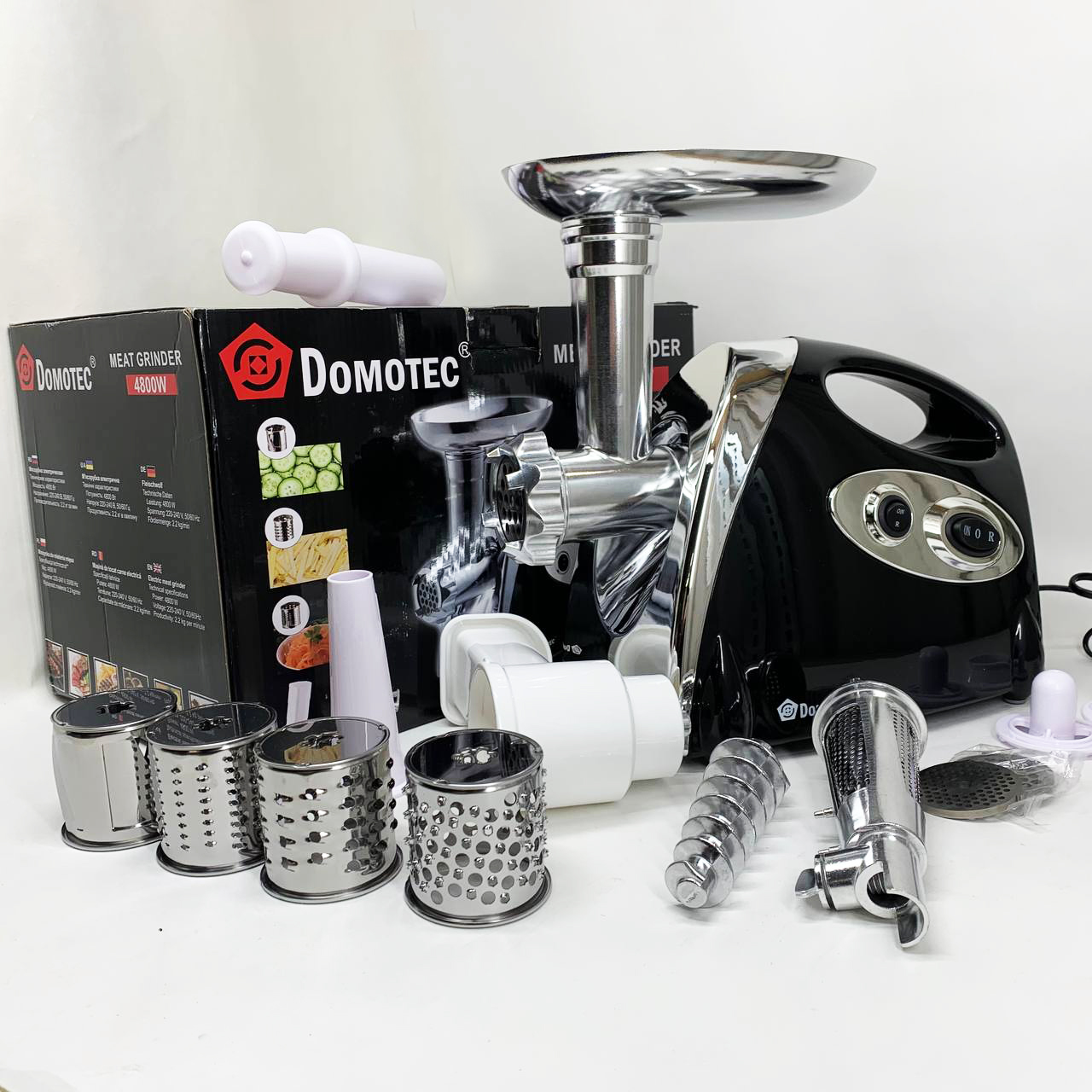 М'ясорубка електрична DOMOTEC MS-2025 3 в 1 4800 Вт із соковижималкою, терками, шатківниками та реверсом - Зображення 7